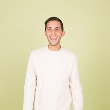 Stock portrait of a person in a cream sweater