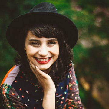 Stock portrait of a person wearing a black hat