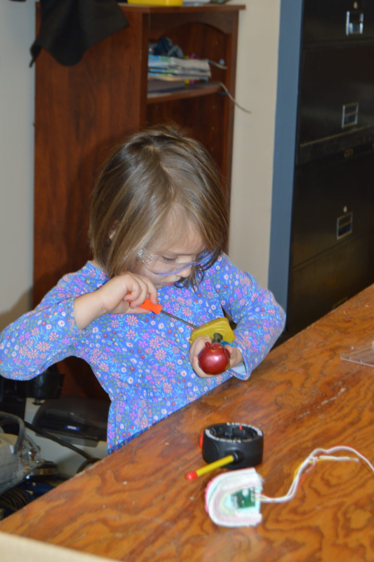 A child working at a craft table